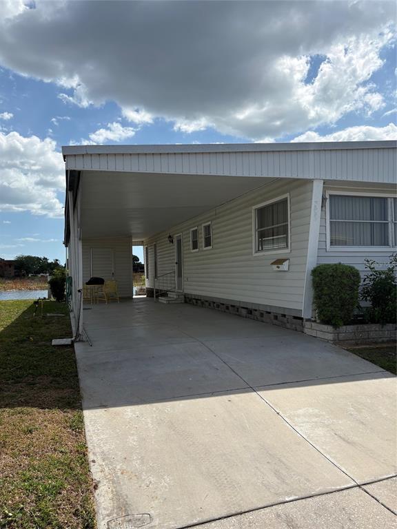 10057 110th Place, Unit 243 Largo, FL 33773 - Photo 4 of 32 a view of a house with a yard
