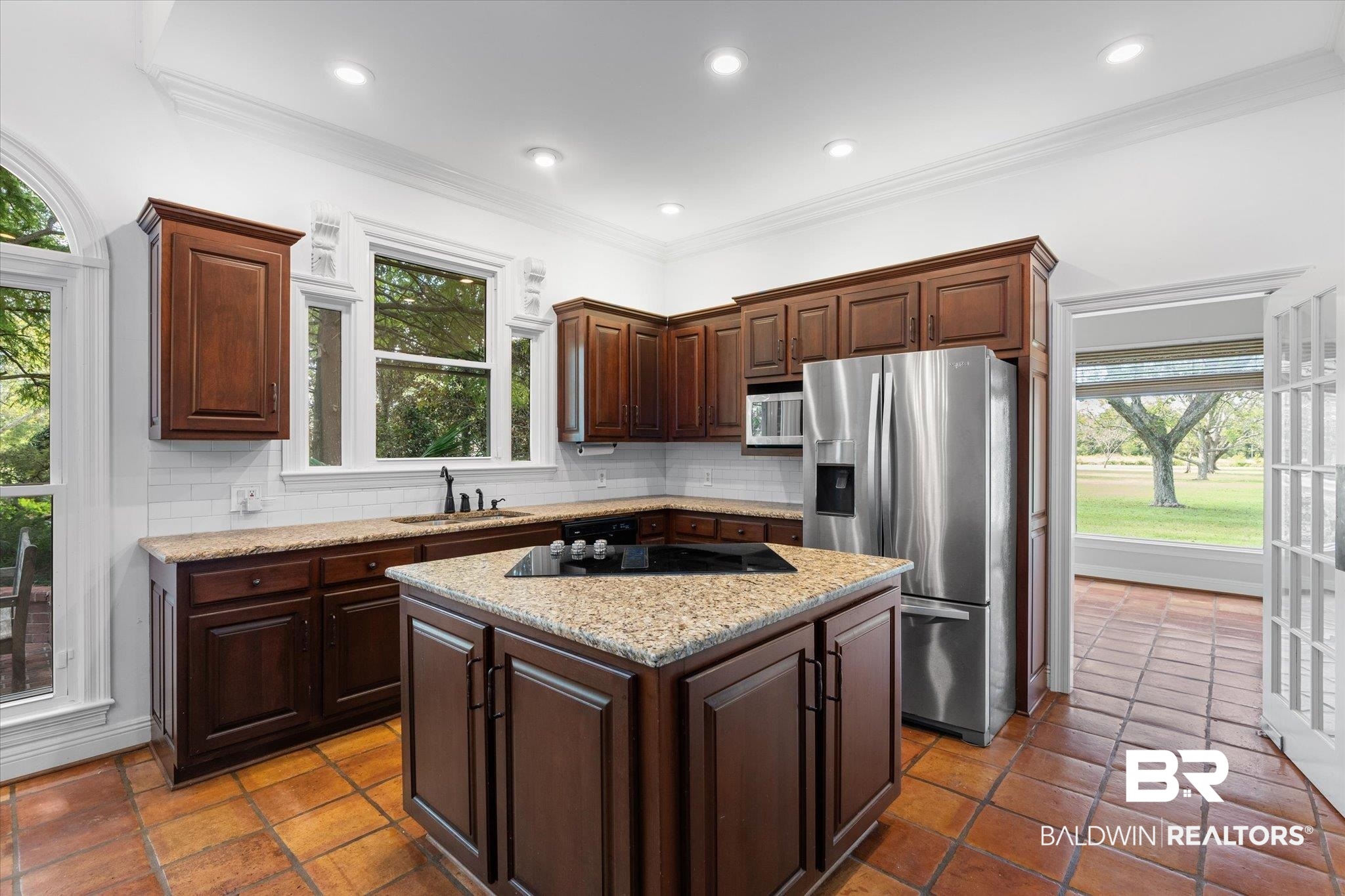 5231 Dawes Road Grand Bay, AL 36541 - Photo 11 of 49 Kitchen with appliances with stainless steel finishes, a center island, decorative backsplash, and a wealth of natural light