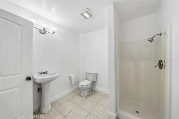 a bed room with double bed and a window