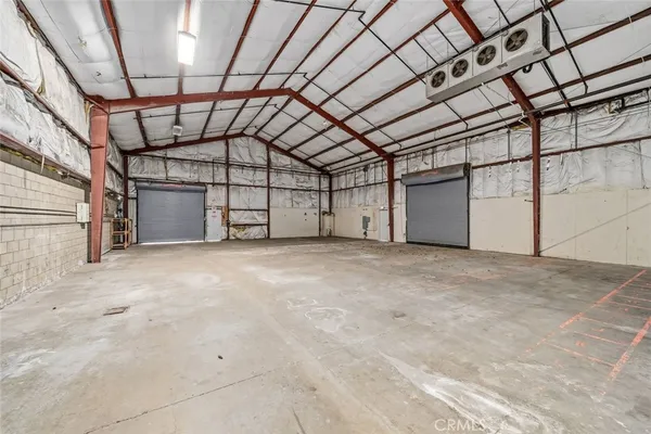 a living room with patio fireplace and a fireplace