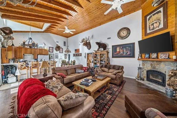 a work room with furniture windows and a flat screen tv