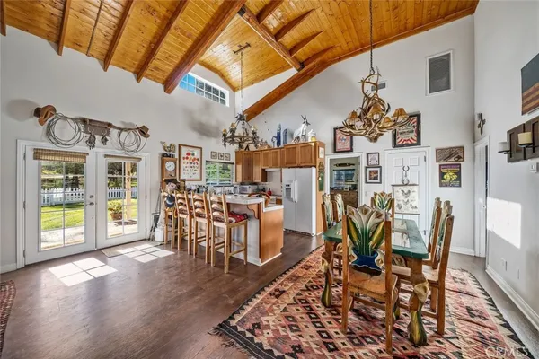 a living room with furniture a rug and a chandelier