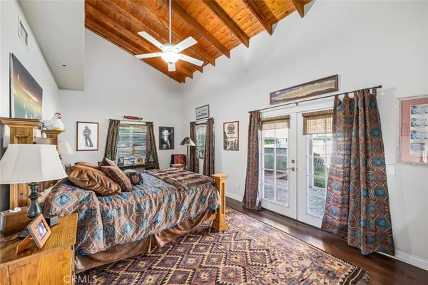 a view of a house with yard and sitting area