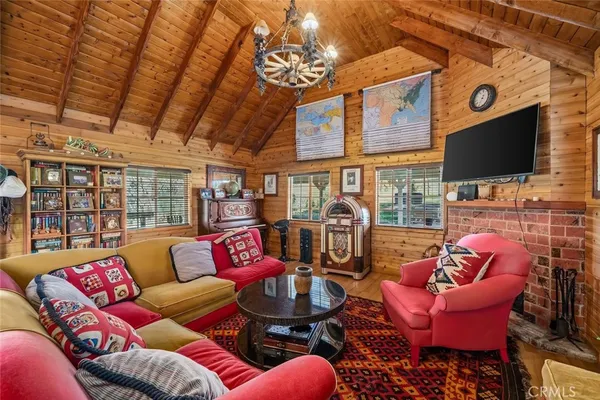 a view of a patio with a table chairs and a backyard