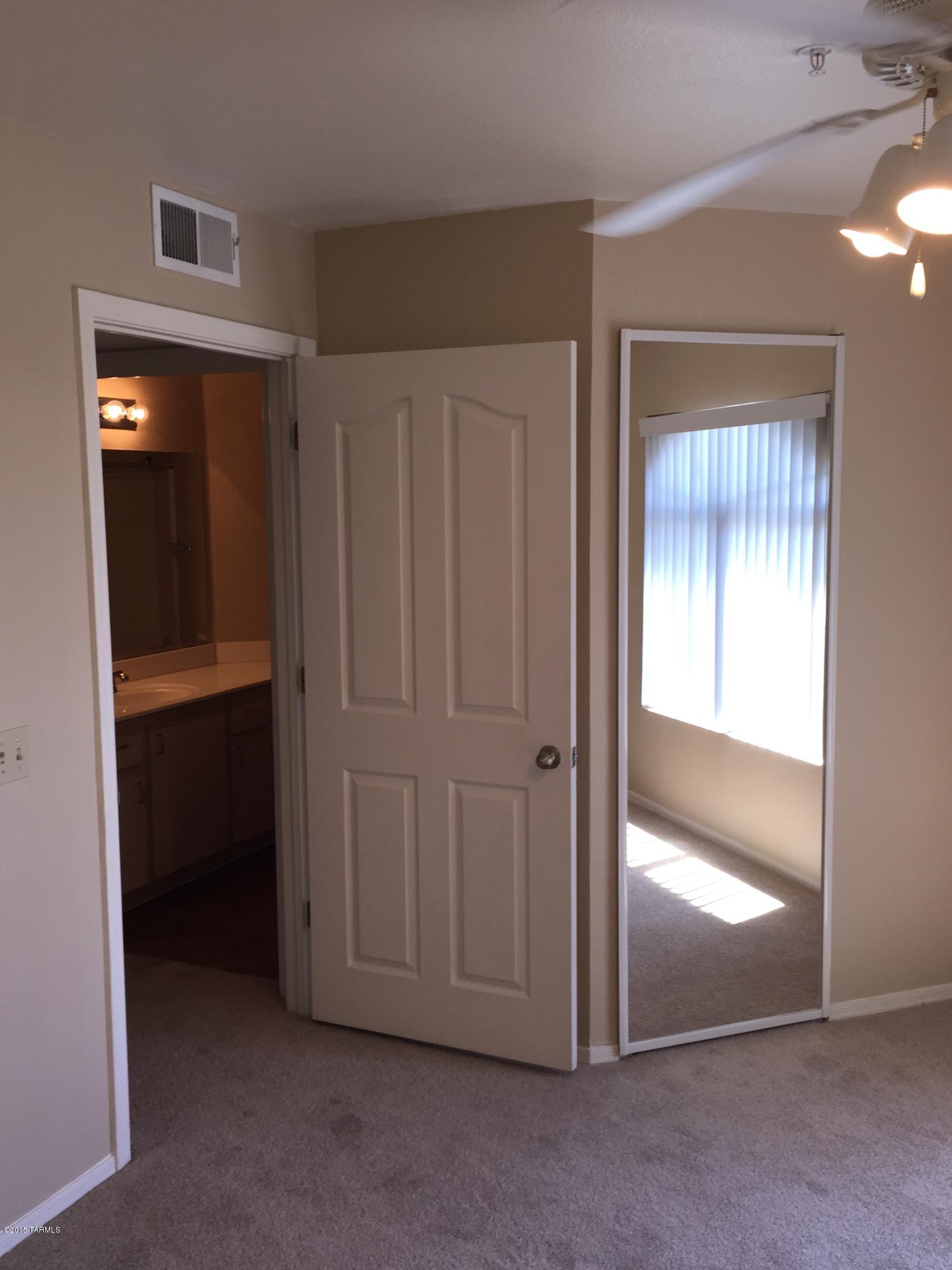 5751 North Kolb Road, Unit 28201 Tucson, AZ 85750 - Photo 13 of 14 an empty room with closet and a bathroom