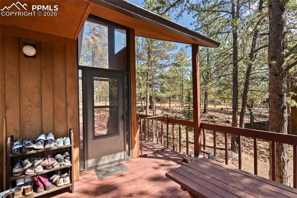 756 Spring Valley Drive Divide, CO 80814 - Photo 3 of 48 a view of a porch with wooden floor