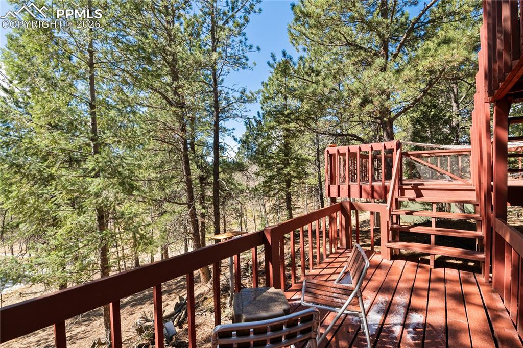 756 Spring Valley Drive Divide, CO 80814 - Photo 33 of 48 a balcony with wooden floor and outdoor space