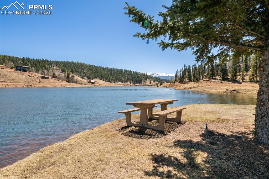 756 Spring Valley Drive Divide, CO 80814 - Photo 40 of 48 a view of a lake with a table and chairs on the roof