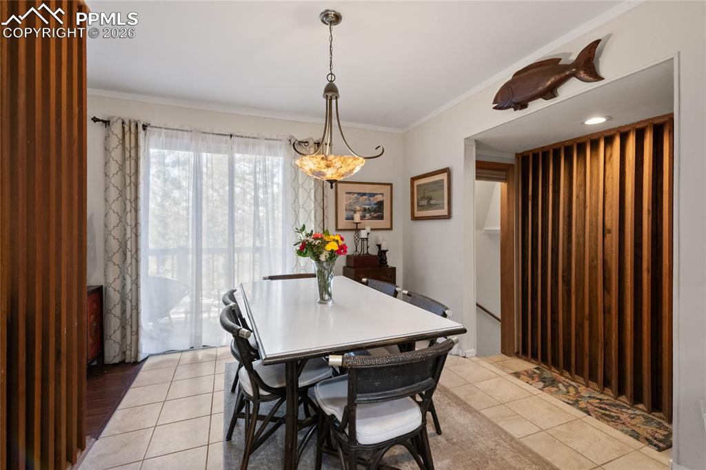 756 Spring Valley Drive Divide, CO 80814 - Photo 7 of 48 a view of a dining room with furniture window and wooden floor