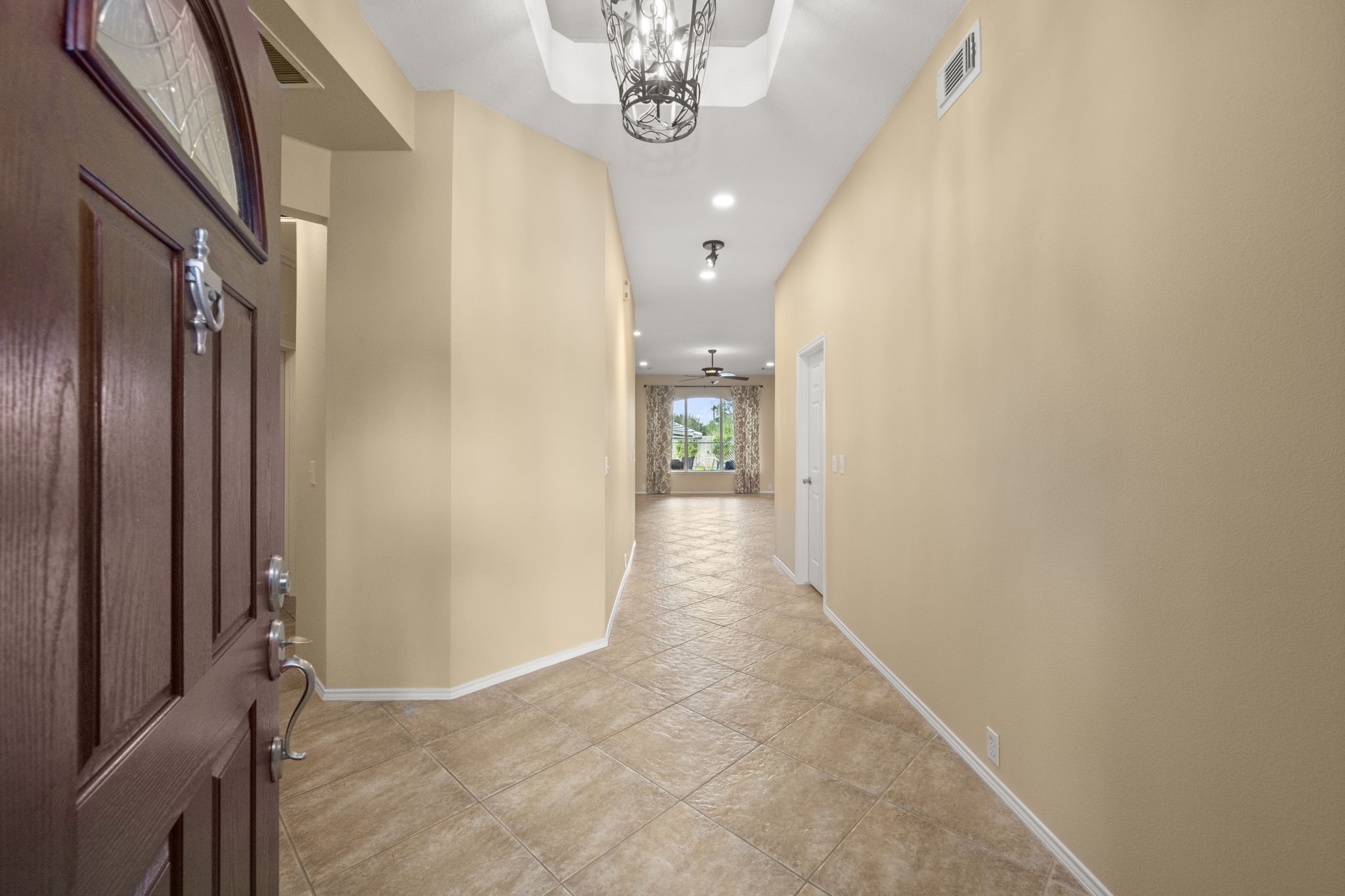 2007 Louetta Spring Drive Spring, TX 77388 - Photo 6 of 50 Step inside to soaring ceilings, abundant natural light, and an inviting entry that sets the tone for the rest of the home. Neutral finishes and an open sightline create an immediate sense of space.