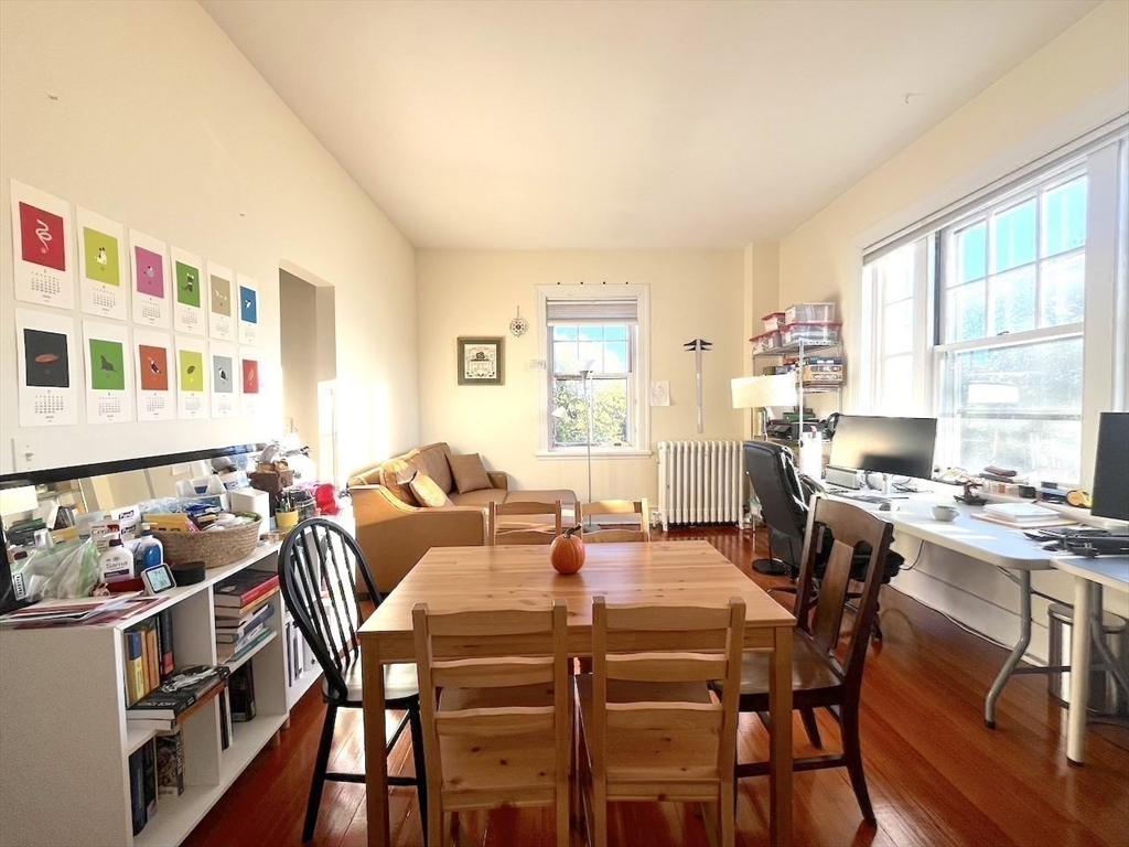 371 Harvard Street, Unit 3C Cambridge, MA 02138 - Photo 12 of 27 a view of a dining room with furniture window and outside view