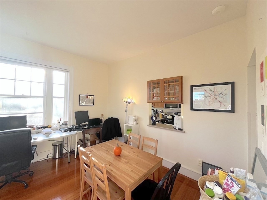 371 Harvard Street, Unit 3C Cambridge, MA 02138 - Photo 13 of 27 a workspace with furniture and window