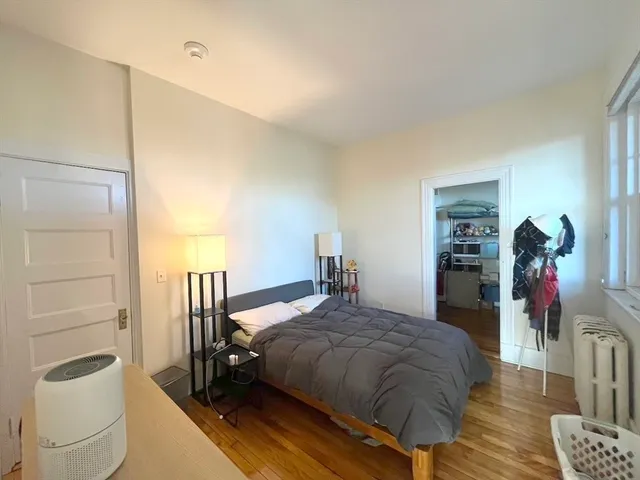 a bedroom with a bed and a closet