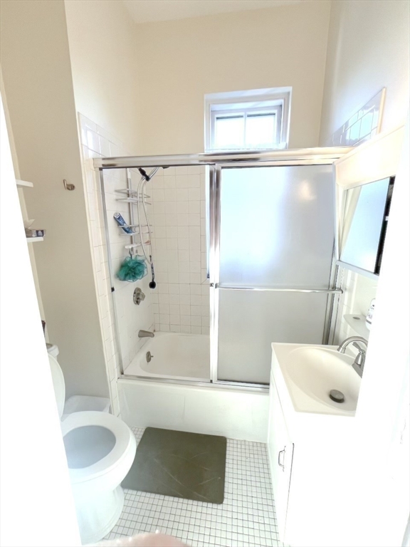 371 Harvard Street, Unit 3C Cambridge, MA 02138 - Photo 23 of 27 a bathroom with a sink a bath tub and a shower