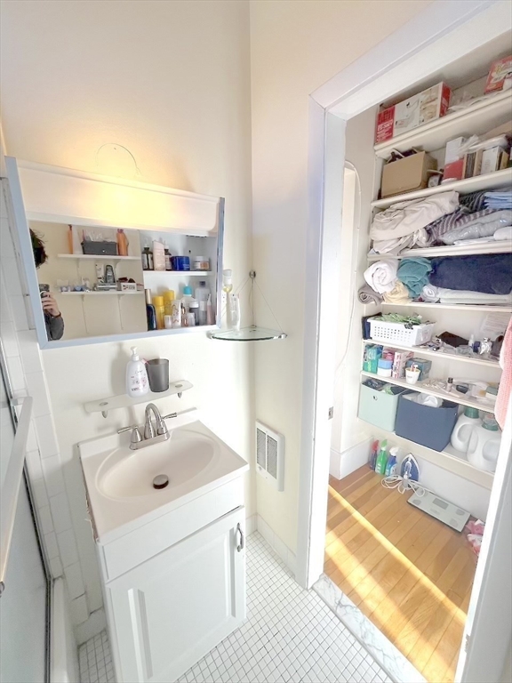 371 Harvard Street, Unit 3C Cambridge, MA 02138 - Photo 24 of 27 a storage room with washer and dryer