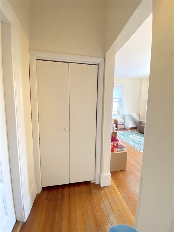 371 Harvard Street, Unit 3C Cambridge, MA 02138 - Photo 5 of 27 a view of a room with wooden floor and bathroom