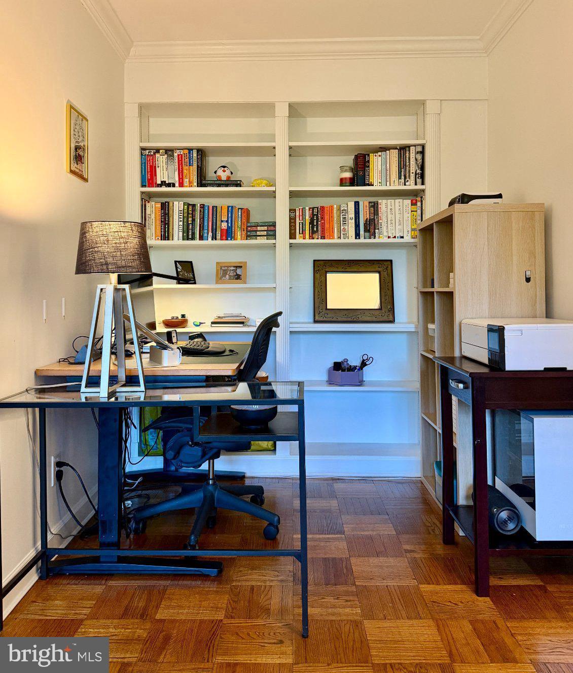 2500 Q Street Northwest, Unit 307 Washington, DC 20007 - Photo 3 of 13 Cozy workspace with stylish shelves.