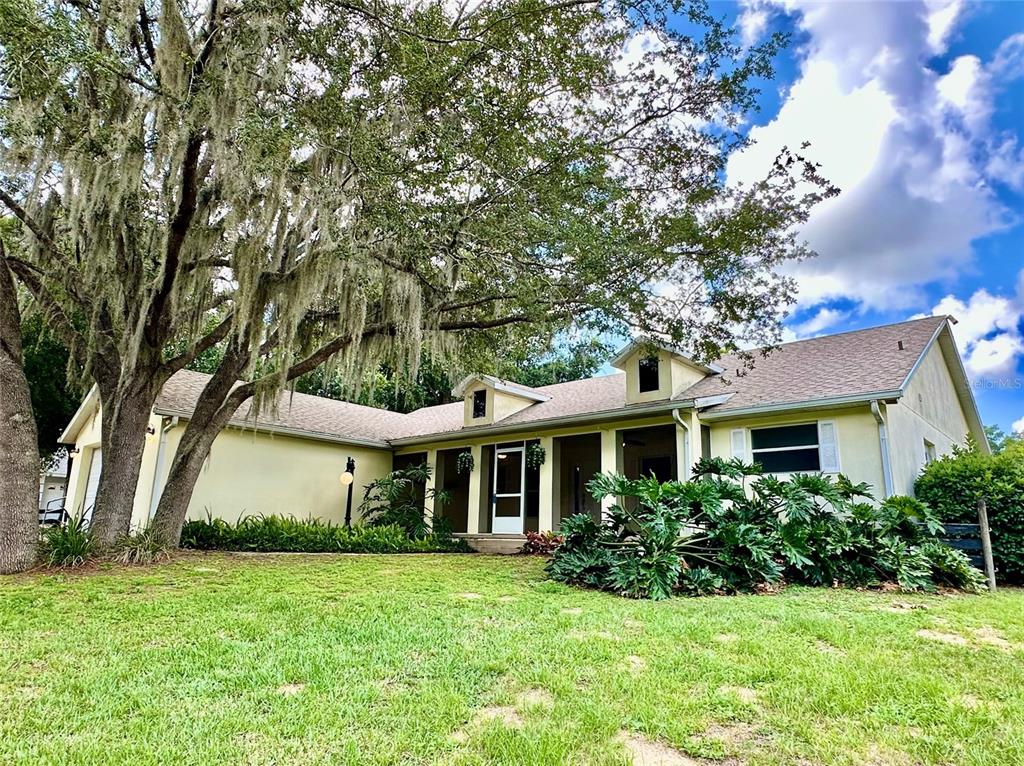 4243 Britt Road Mount Dora, FL 32757 - Photo 1 of 1 a front view of a house with a garden
