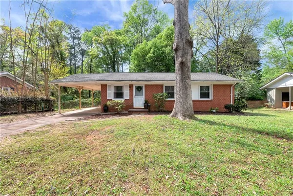 front view of a house with a yard