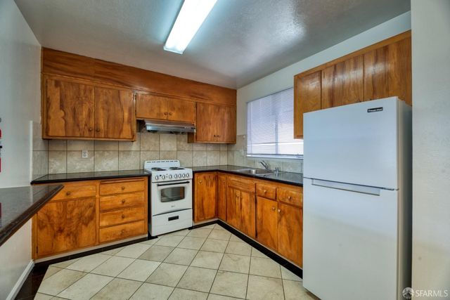 a view of wooden floor and windows in a room