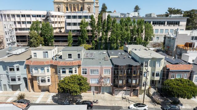 a bedroom with furniture and staircase