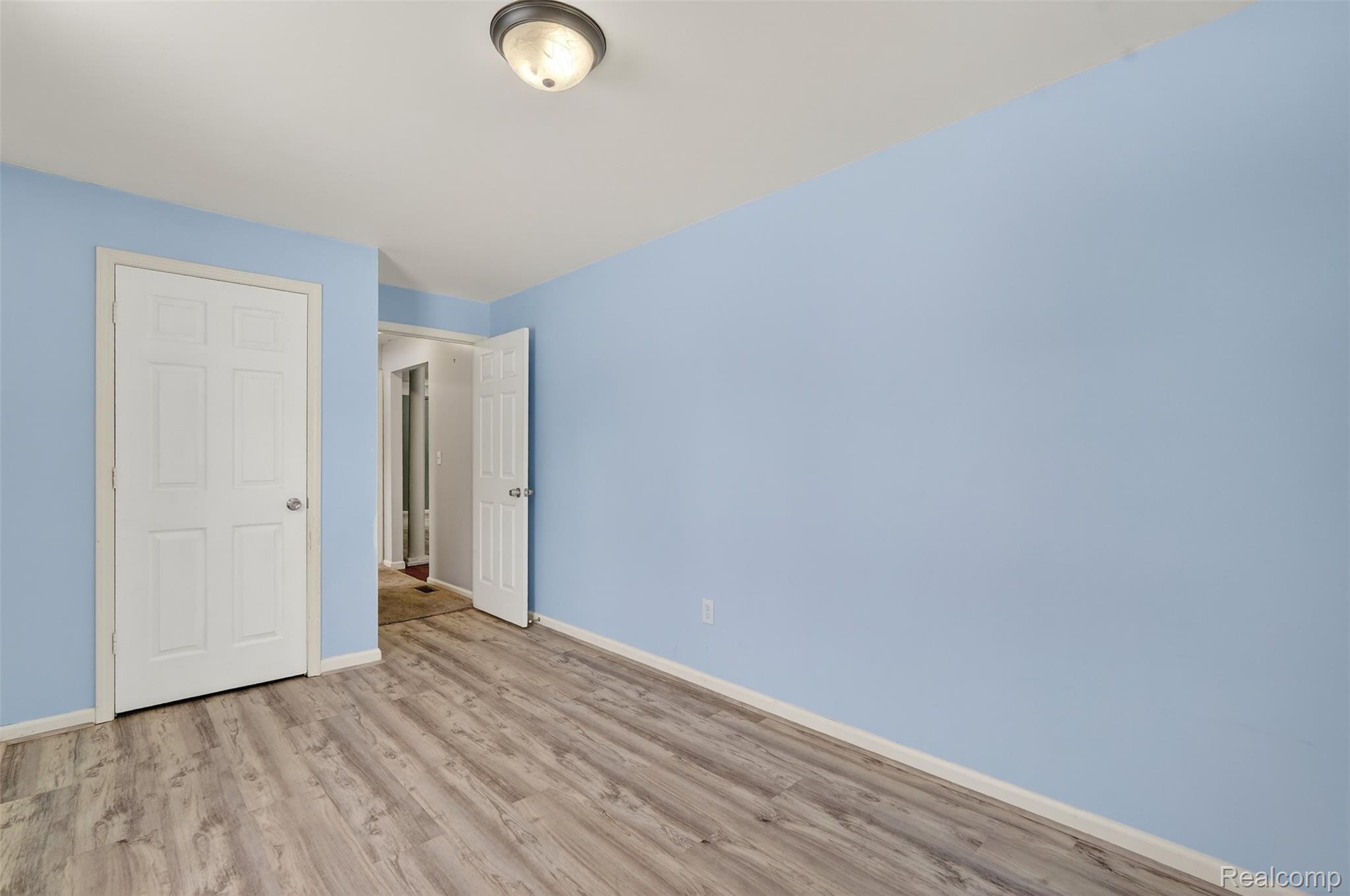 5417 Rensselear Drive Lapeer, MI 48446 - Photo 30 of 41 Unfurnished bedroom featuring wood finished floors and baseboards