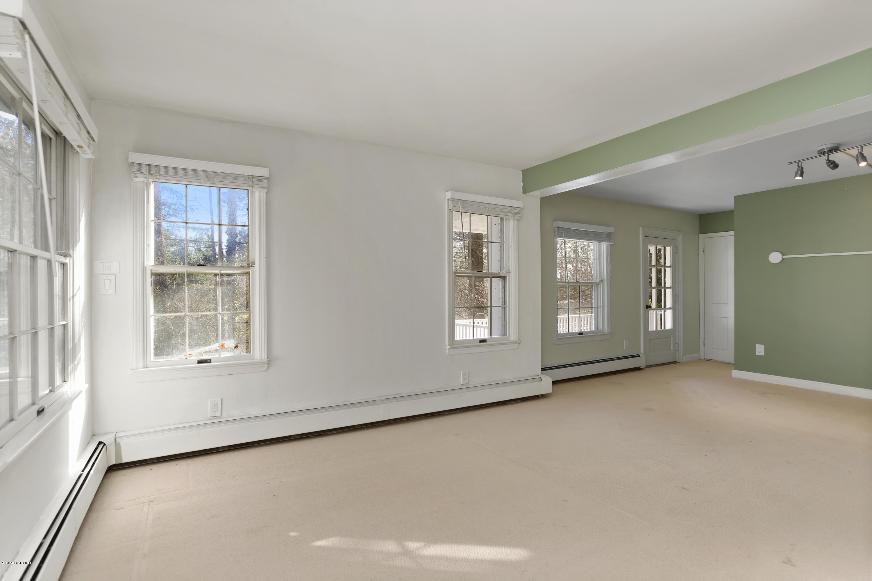 59 Cherry Valley Road Greenwich, CT 06831 - Photo 8 of 19 an empty room with windows