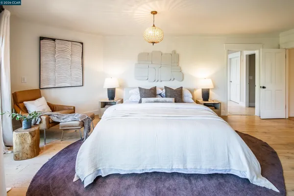 a spacious bathroom with a sink a mirror and a bathtub