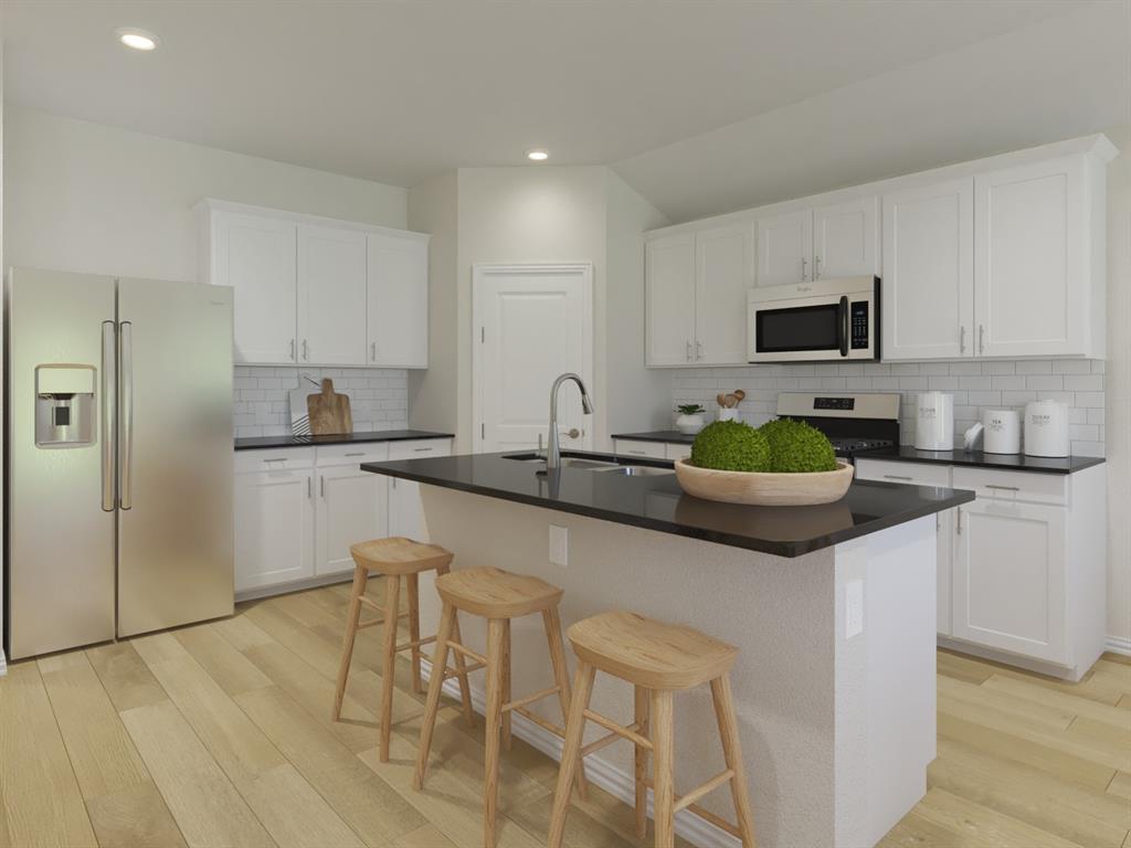 2624 Grand Cyn Street Anna, TX 75409 - Photo 1 of 1 a kitchen with a sink cabinets and stainless steel appliances