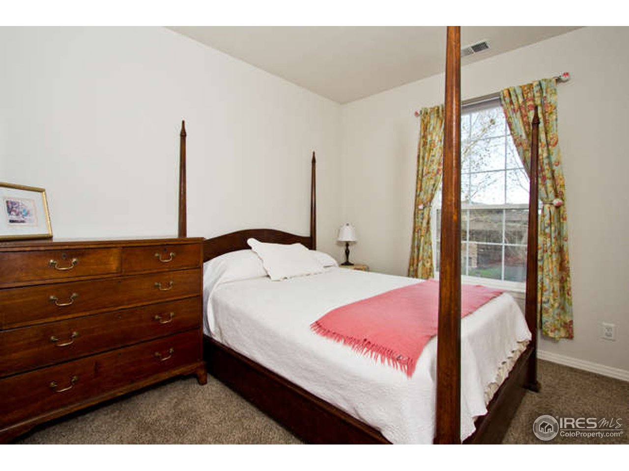 3460 Rookery Road Fort Collins, CO 80528 - Photo 18 of 23 a bedroom with a bed and large window