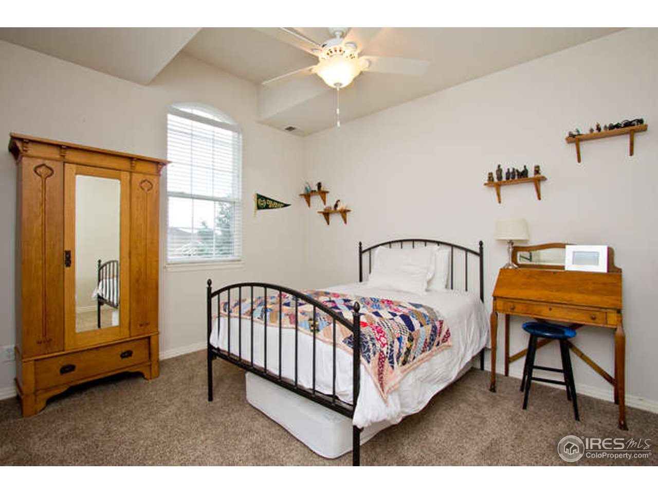 3460 Rookery Road Fort Collins, CO 80528 - Photo 22 of 23 a bedroom with a bed and a window