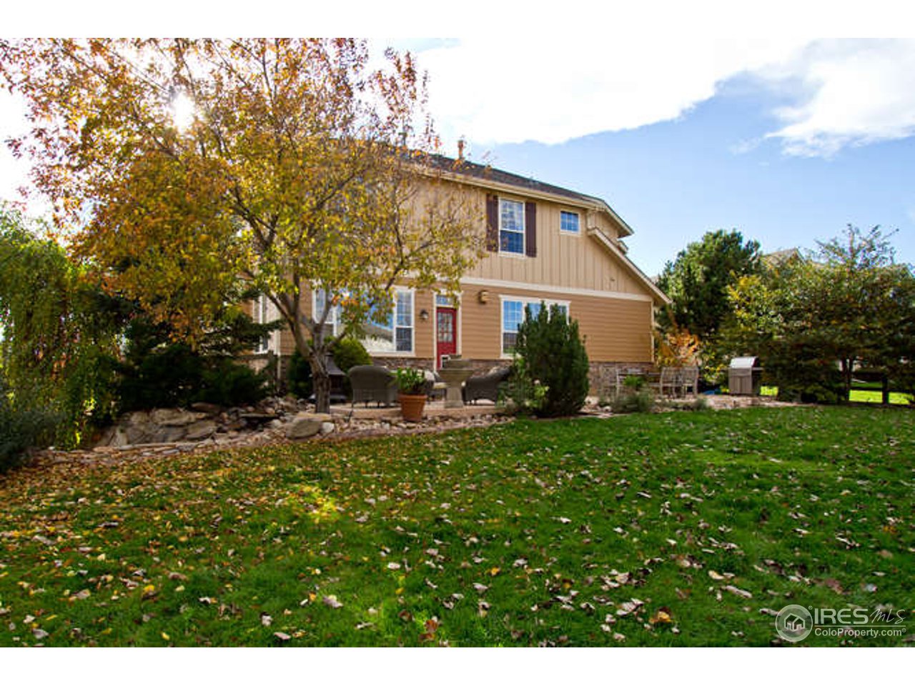 3460 Rookery Road Fort Collins, CO 80528 - Photo 5 of 23 a view of a house with a backyard