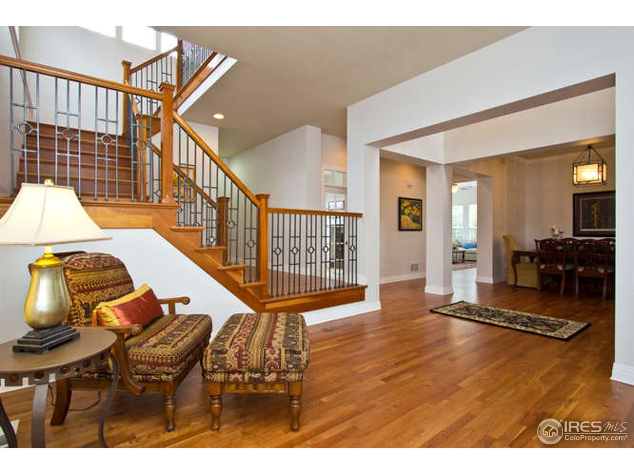 3460 Rookery Road Fort Collins, CO 80528 - Photo 7 of 23 a view of a livingroom with furniture wooden floor and windows