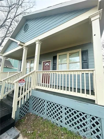a view of a brick house with large window
