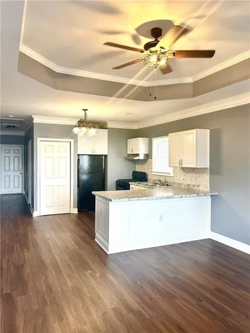 a view of a kitchen with a sink and a window