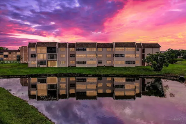 a view of a lake with a building in front of it