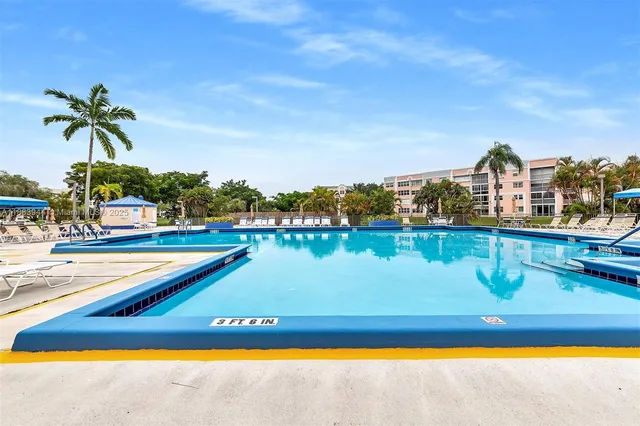 a view of a swimming pool with an ocean view
