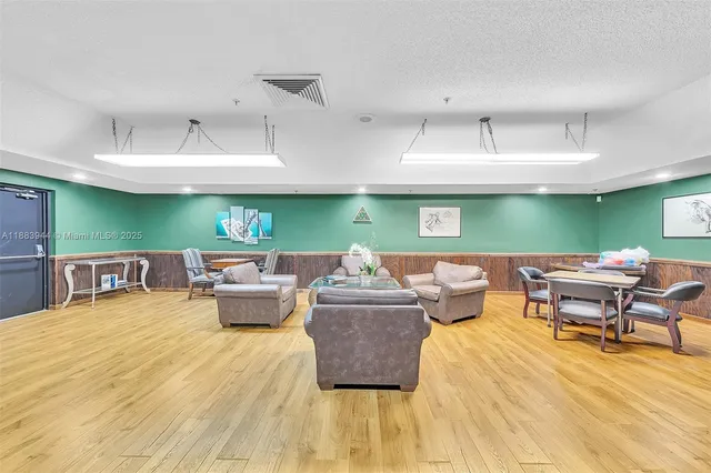 a living room with lots of furniture and a wooden floor