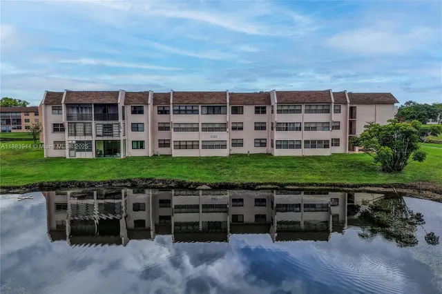 a couple of chairs sitting in a backyard