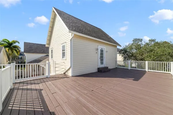 a view of a kitchen with a sink and refrigerator