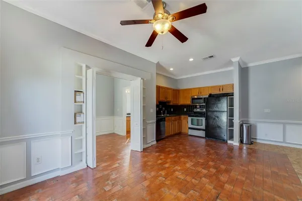 a kitchen with stainless steel appliances granite countertop a refrigerator sink and cabinets