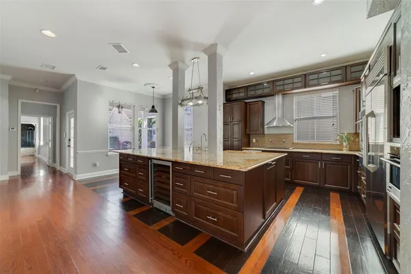 a spacious bathroom with a double vanity sink and a large mirror