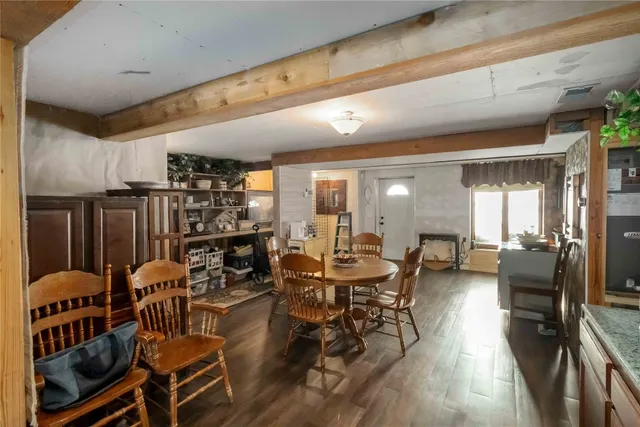 a living room with lots of furniture and wooden floors