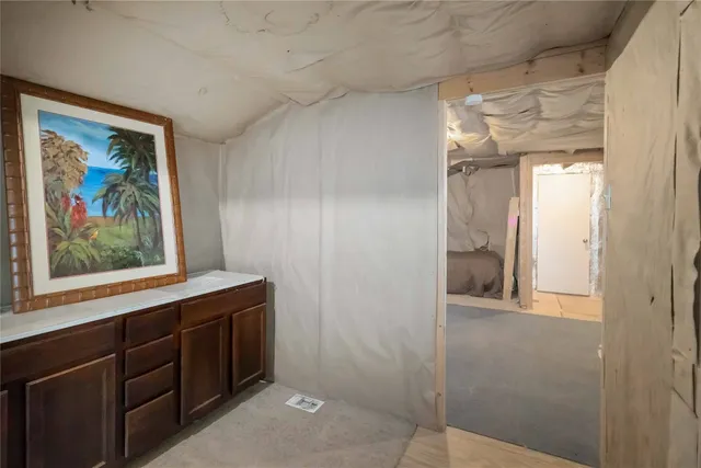 a view of a bathroom with a sink and mirror