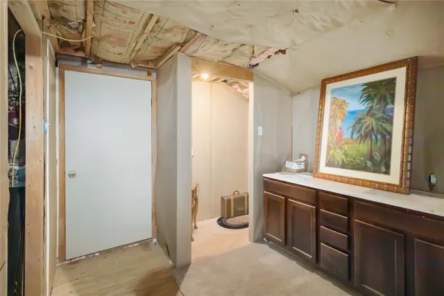 a view of a livingroom with furniture and front door