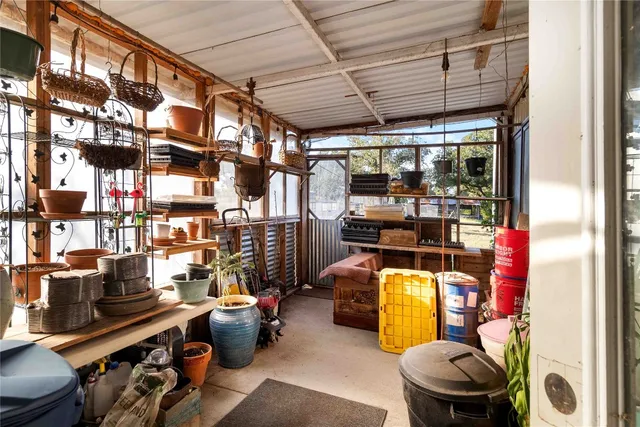 a view of a house with a yard covered in snow