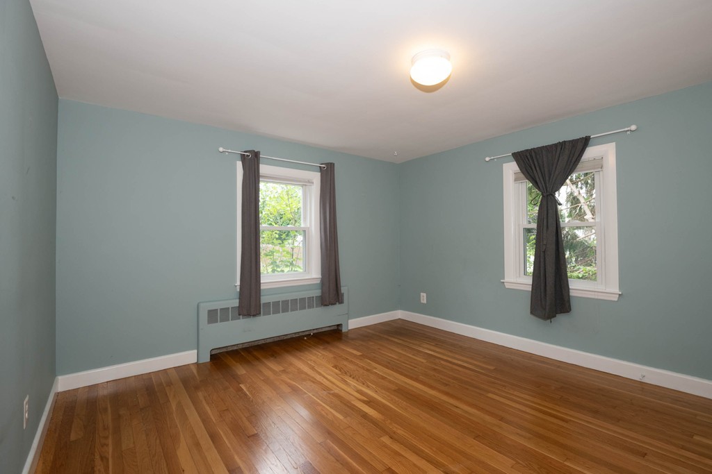 27 Margaret Road Hamilton, MA 01982 - Photo 14 of 30 an empty room with wooden floor and windows