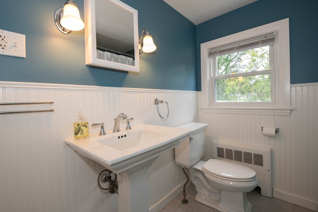 27 Margaret Road Hamilton, MA 01982 - Photo 17 of 30 a bathroom with a sink a mirror and a toilet