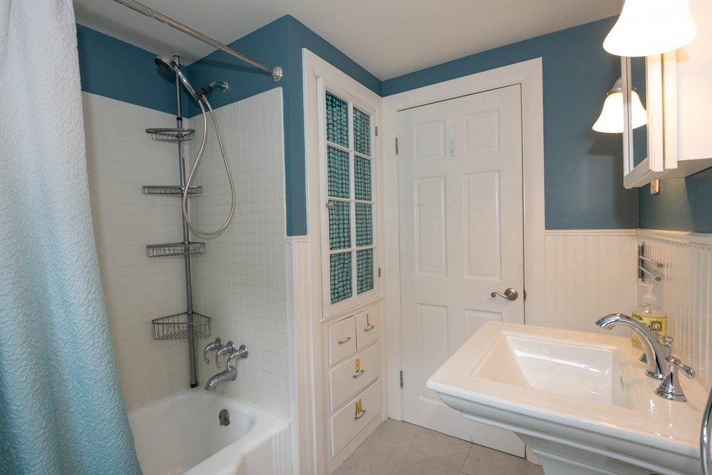 27 Margaret Road Hamilton, MA 01982 - Photo 18 of 30 a bathroom with a tub a sink and a shower