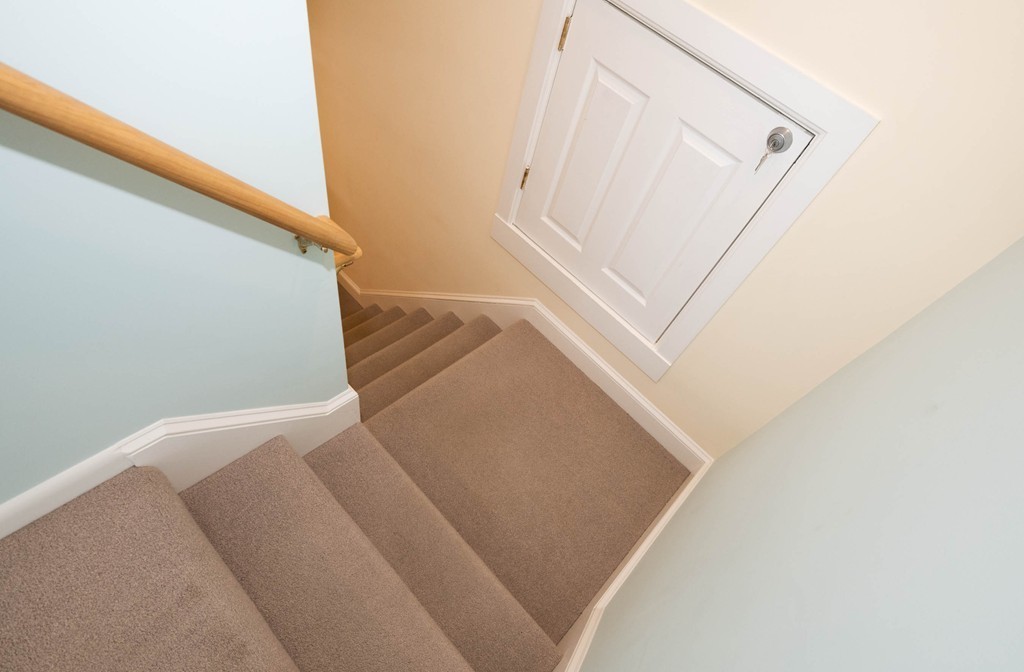 27 Margaret Road Hamilton, MA 01982 - Photo 20 of 30 a view of staircase with white walls and white door
